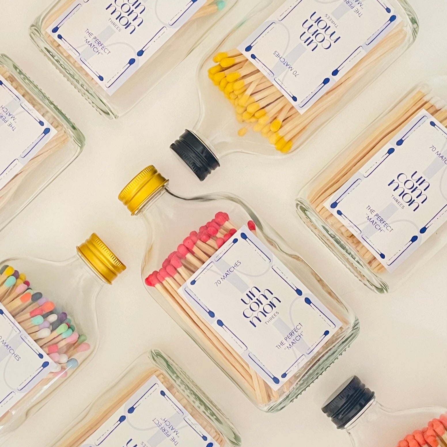 Mach bottles filled with 9.8 cm colourful safety matches with a choice of gold or black lid.