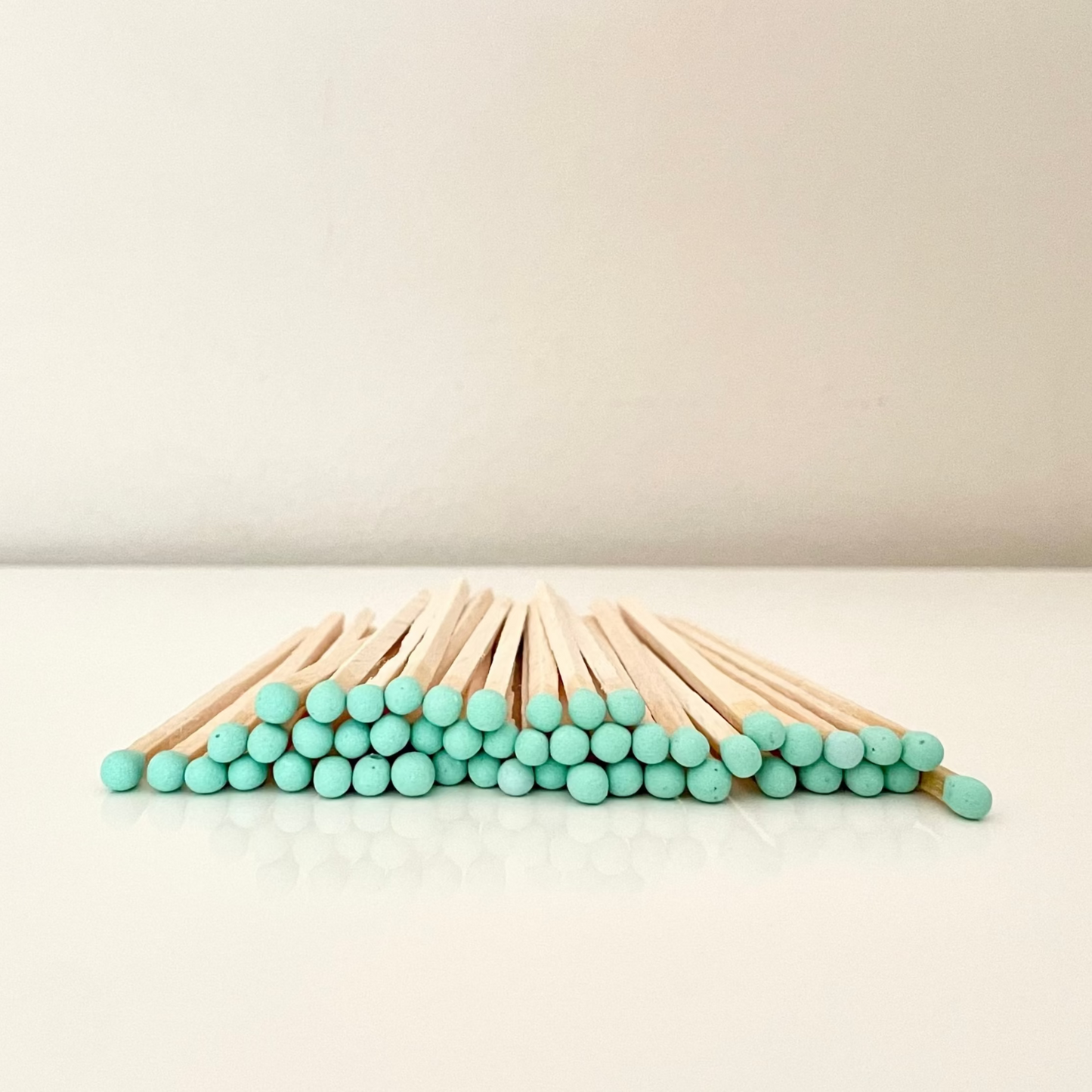9.8 cm aqua matches on surface.