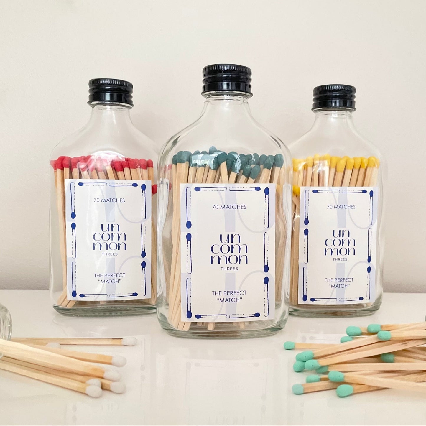 Black lid match bottles filled with 9.8cm coloured matches.