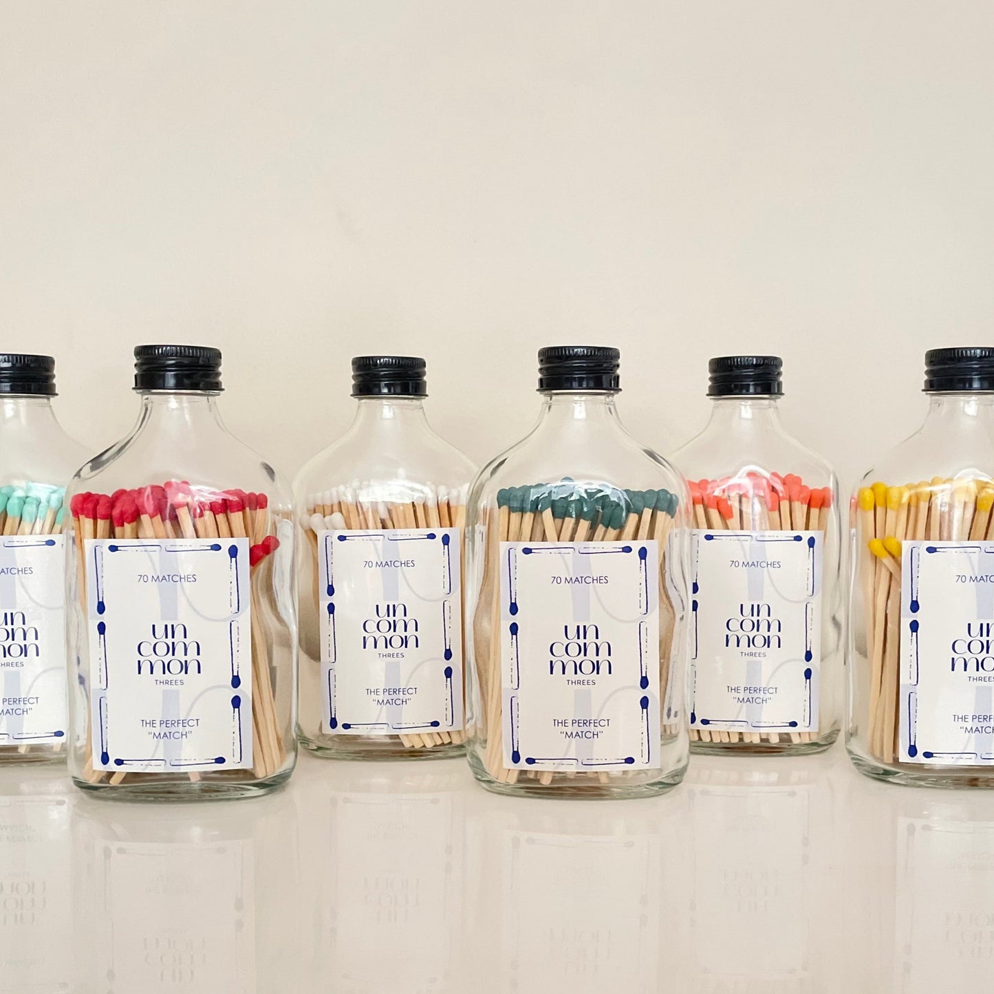 Match bottles filled with 9.8cm coloured matches.