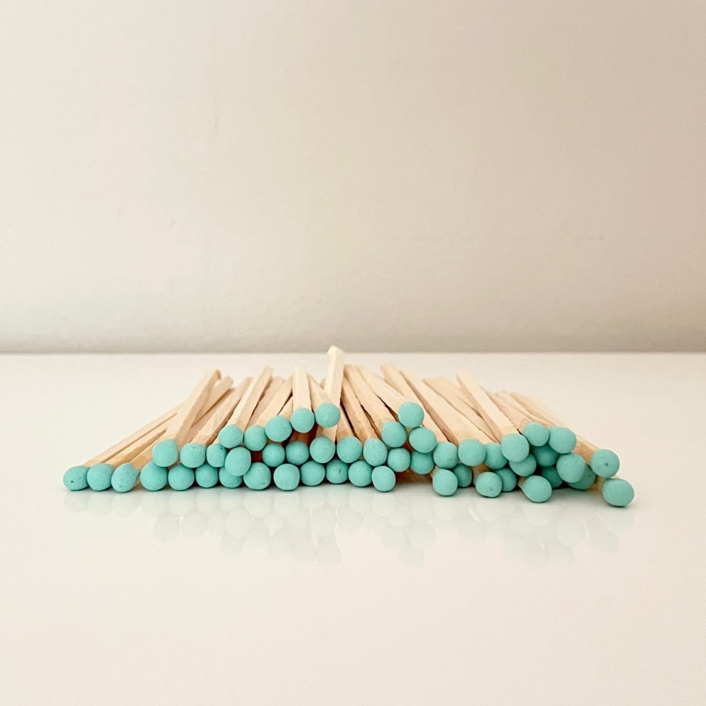 9.8 cm coral matches on surface.