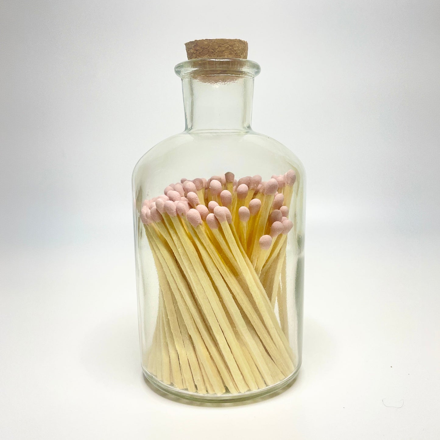 Apothecary match bottle filled with 7.5 cm light pink matches.