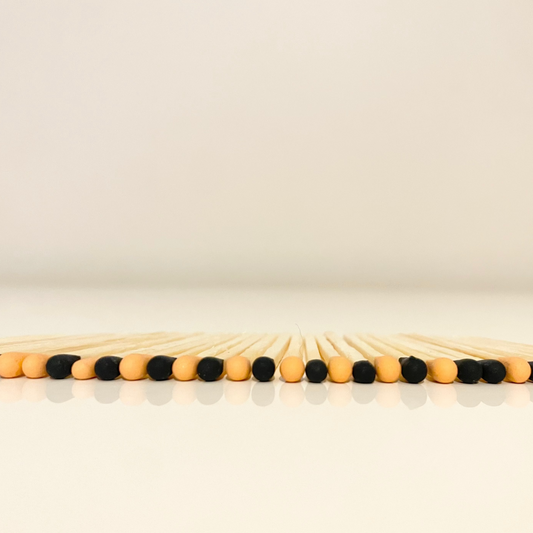 4.8 cm halloween inspired matches on white surface.