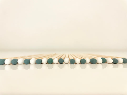 close up view of 9.8 cm mistletoe long safety matches on white surface.