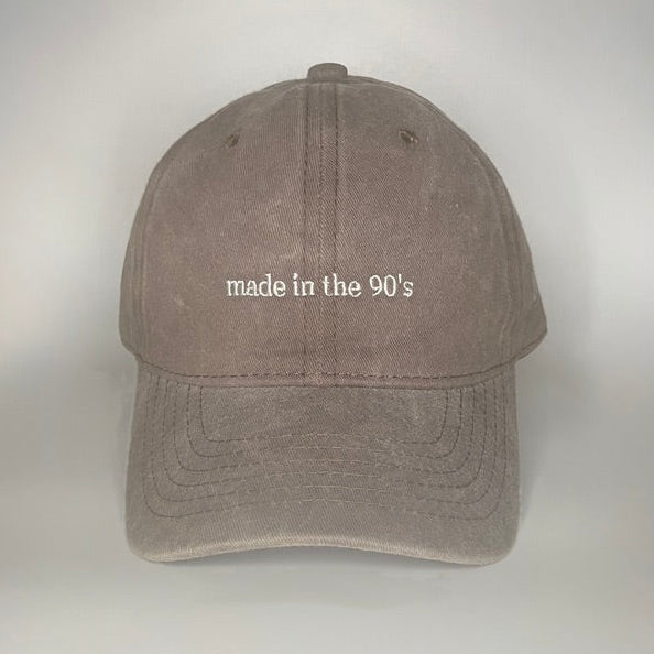 100% Brown washed cotton cap with white embroidery. 