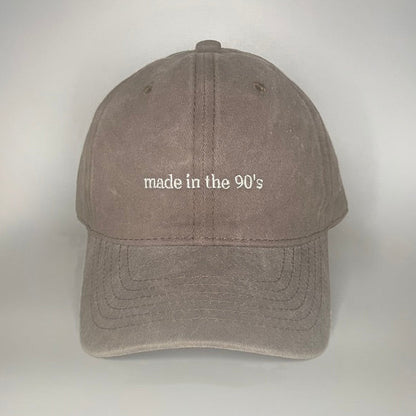 100% Brown washed cotton cap with white embroidery. 