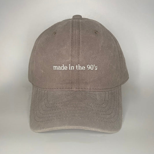 100% Brown washed cotton cap with white embroidery. 