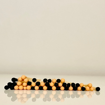 4.8 cm halloween inspired matches on white surface.