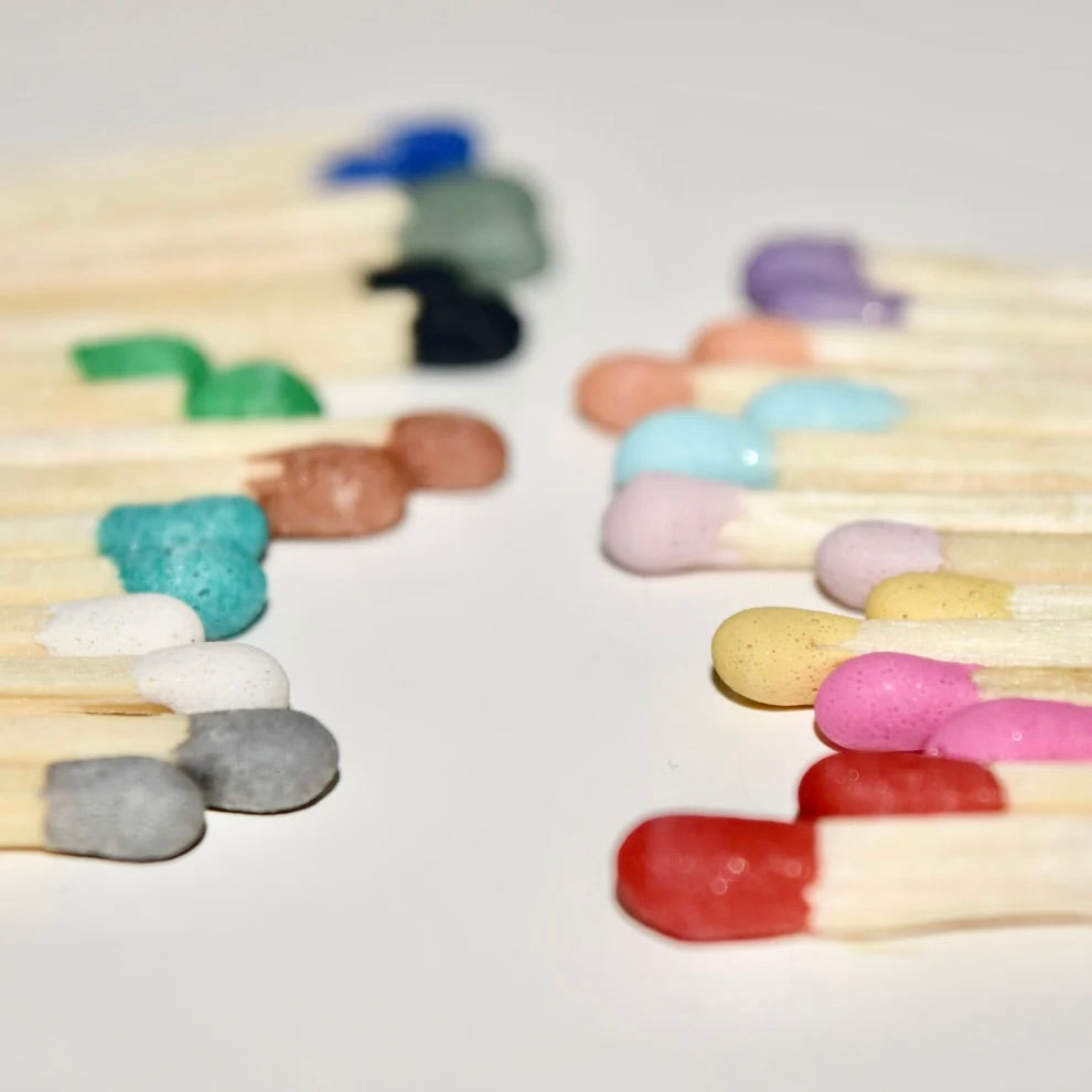 4.8 cm matches with coloured tips on a white surface. 