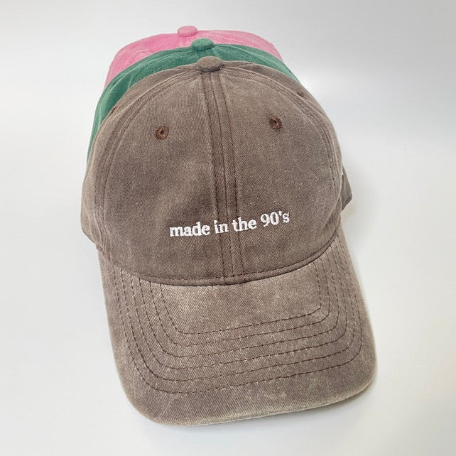 100% Brown washed cotton cap with 'made in the 90's' white embroidery. 