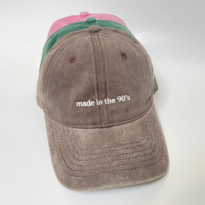 100% Brown washed cotton cap with 'made in the 90's' white embroidery. 