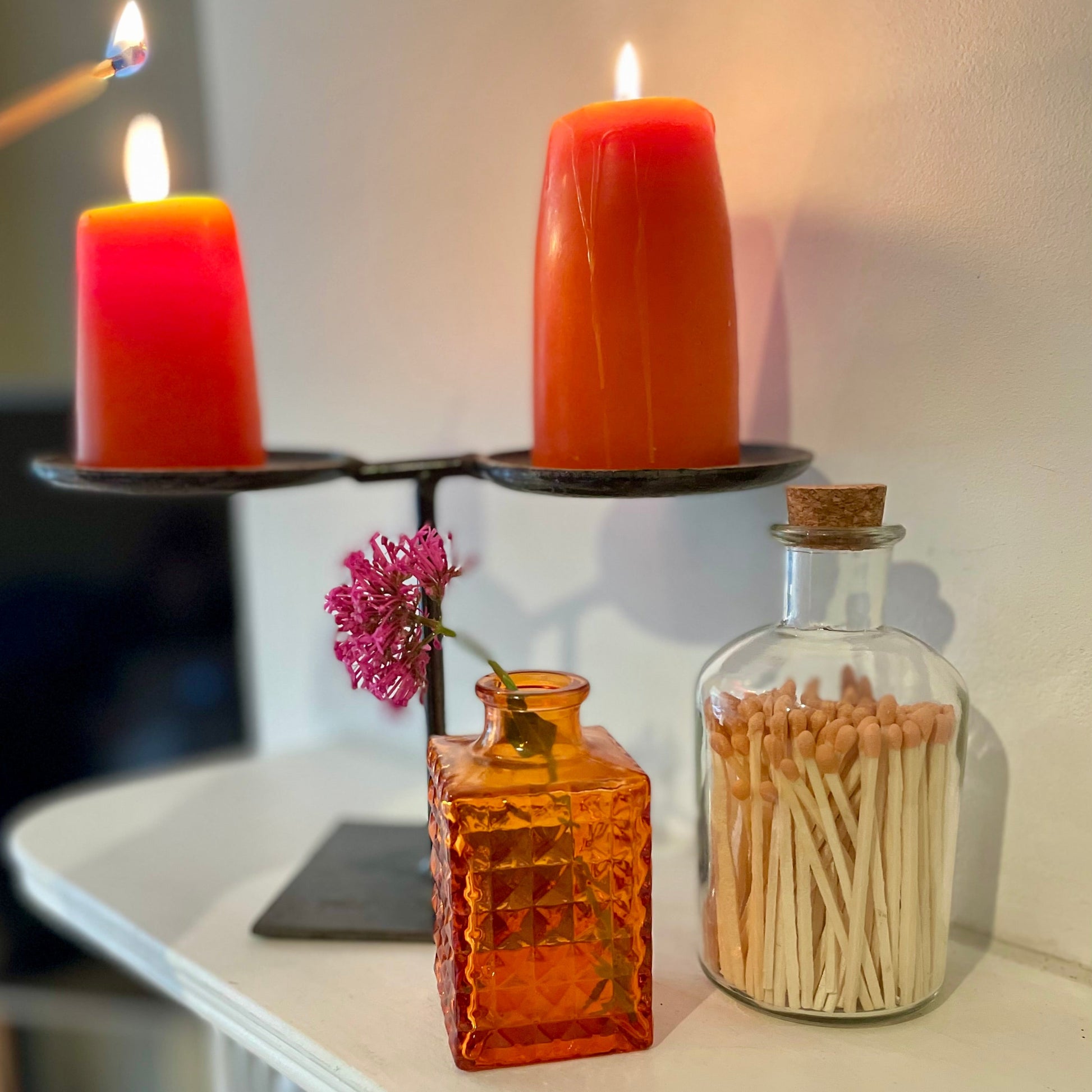 Colourful apothecary match bottle on shelf.
