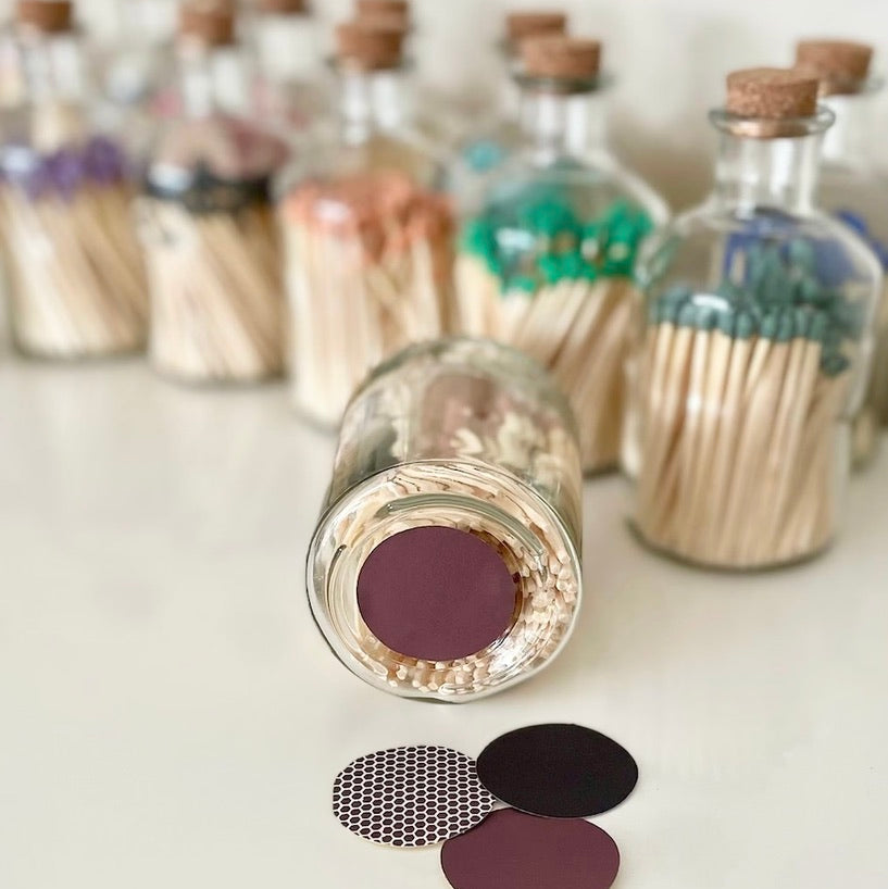 Bottled matches with the choice of brown, black or honeycomb self adhesive striker.