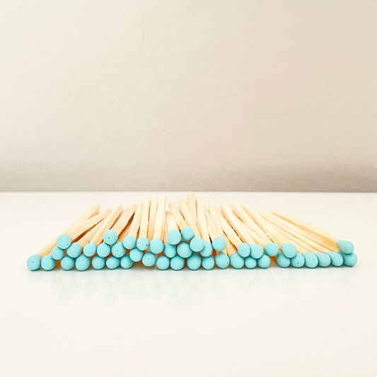 4.8 cm aqua matches on a white surface. 