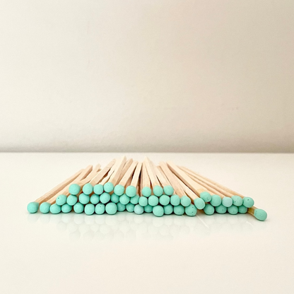 9.8 cm aqua matches on surface.