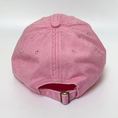 Pink cap with metal clasp on white background. 