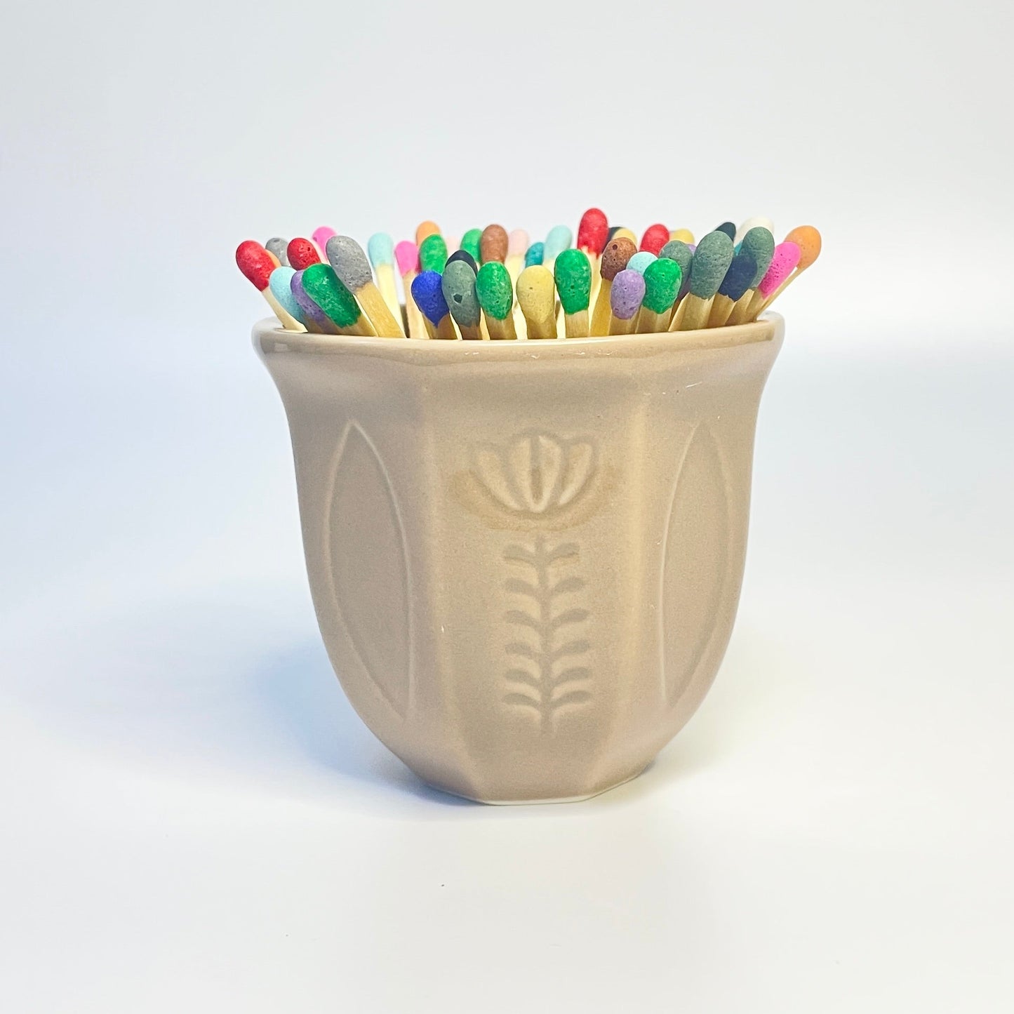 Beige match holder/coffee cup filled with 7.5cm all colours safety matches. 