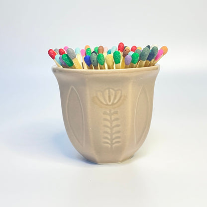 Beige match holder/coffee cup filled with 7.5cm all colours safety matches. 