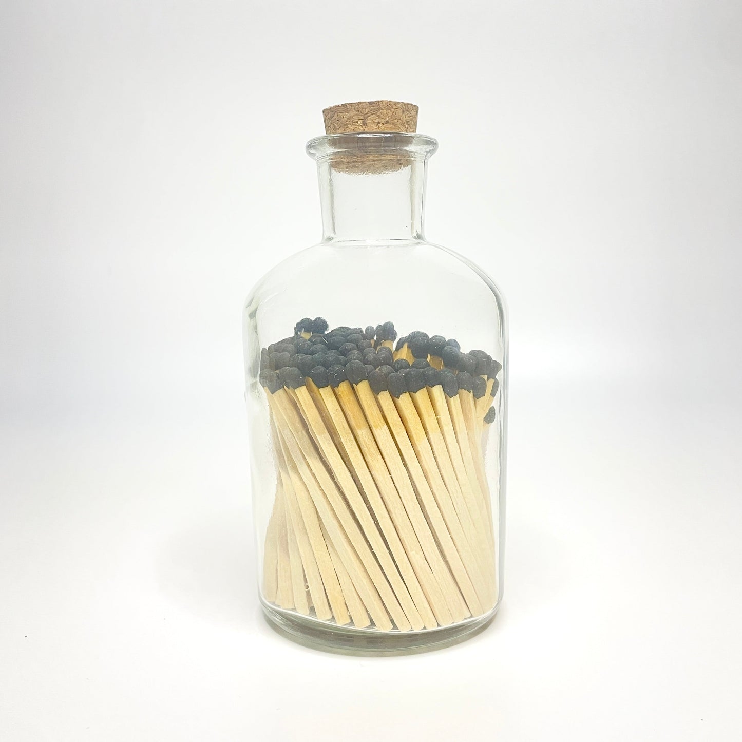 Apothecary match bottle filled with 7.5 cm black matches. 