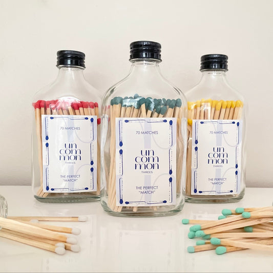 Black lid match bottles filled with 9.8cm coloured matches.