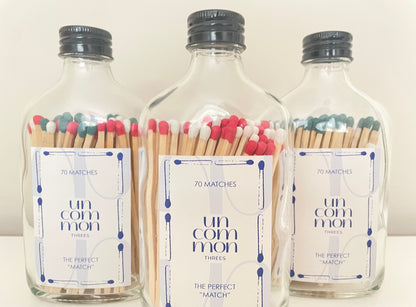 Black lid glass bottles filled with festive coloured safety matches. The refill matches in this listing are designed to complement these bottles.
