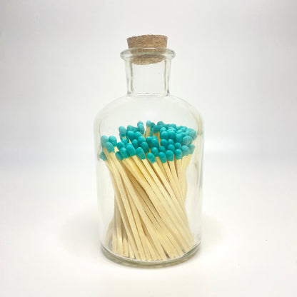 Apothecary match bottle filled with 7.5 cm blue matches. 
