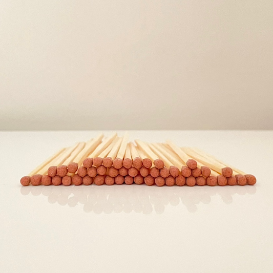 7.5 cm brown matches on a white surface. 