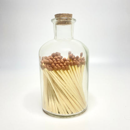 Apothecary match bottle filled with 7.5 cm brown matches. 