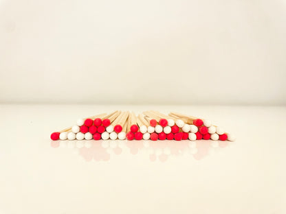 9.8 cm candy cane matches on white surface.