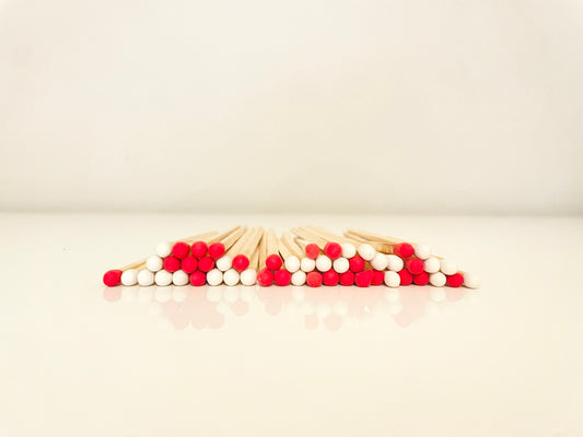 9.8 cm candy cane matches on white surface.