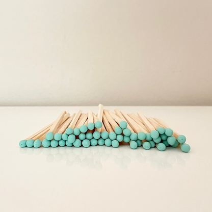 9.8 cm coral matches on surface.