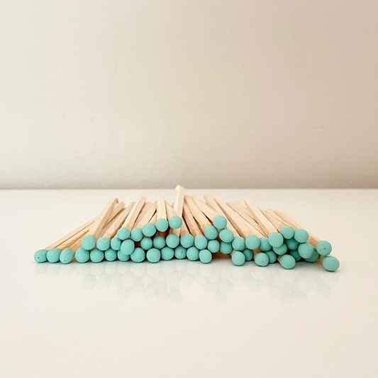 9.8 cm coral matches on surface.