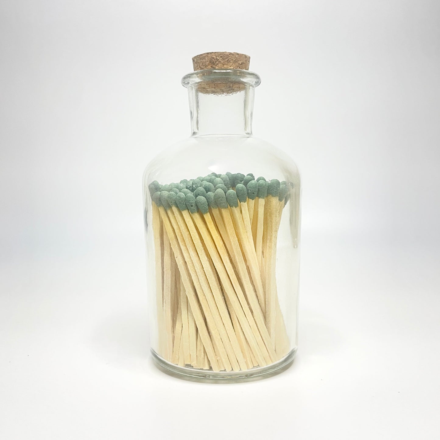 Apothecary match bottle filled with 7.5 cm forest green matches. 