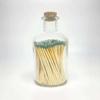 Apothecary match bottle filled with 7.5 cm forest green matches. 