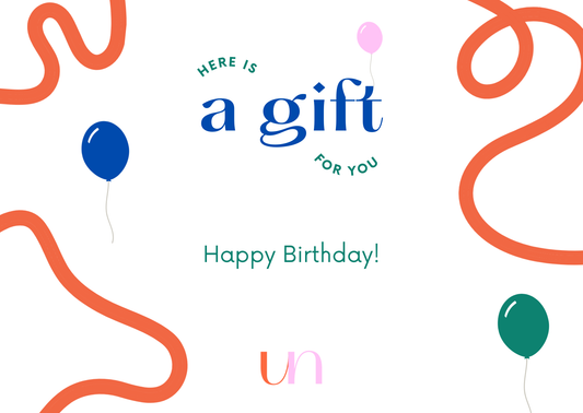 Gift card design with orange ribbons and colourful balloons on a white background, featuring text 'Here is a gift for you. Happy Birthday!' and the brand emblem 'un'.