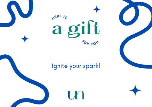 Gift card design with blue ribbons and stars on a white background, featuring text 'Here is a gift for you. Ignite your spark!' and the brand emblem 'un'.