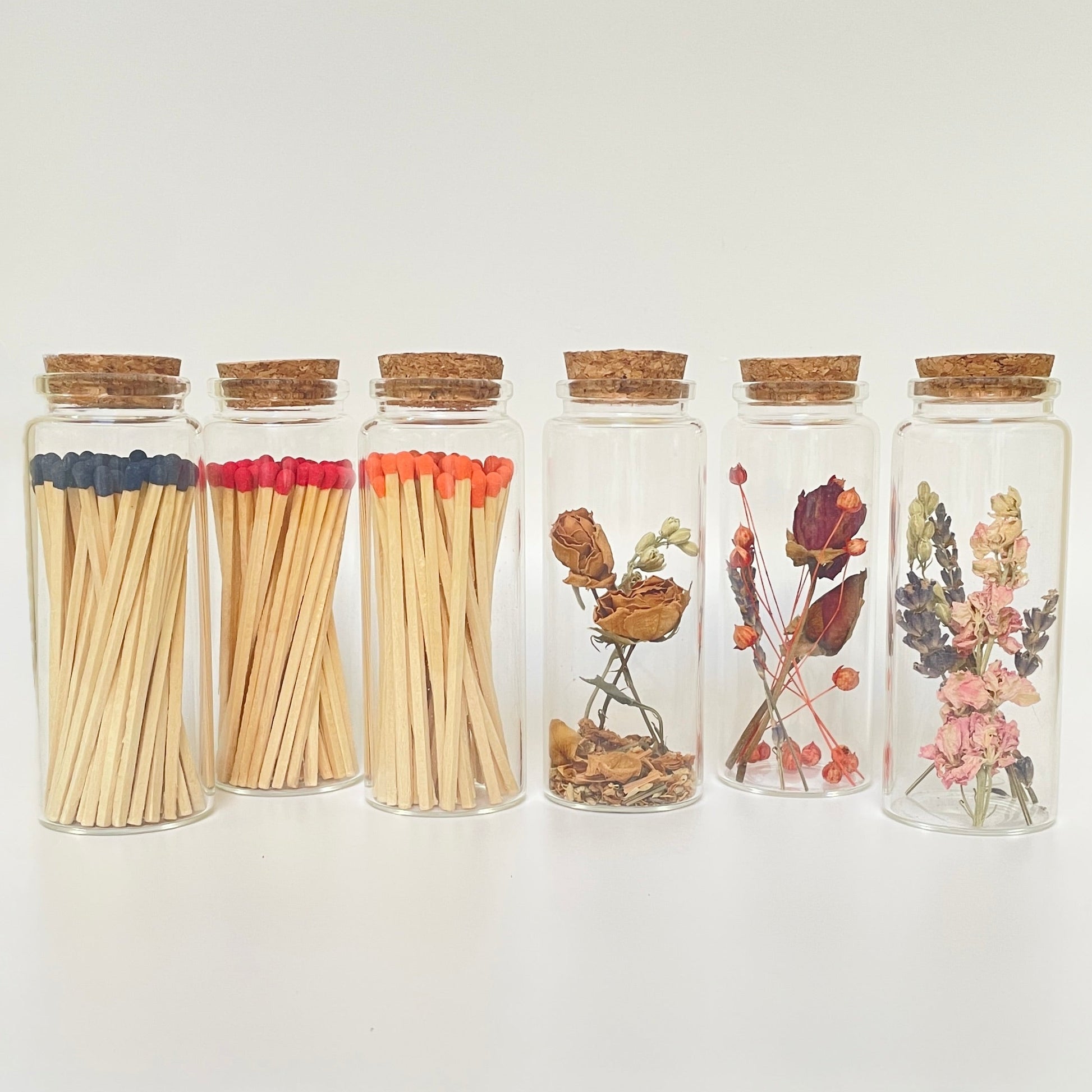 Dried flower test tube gift set with glass match bottle containing 50 safety matches.