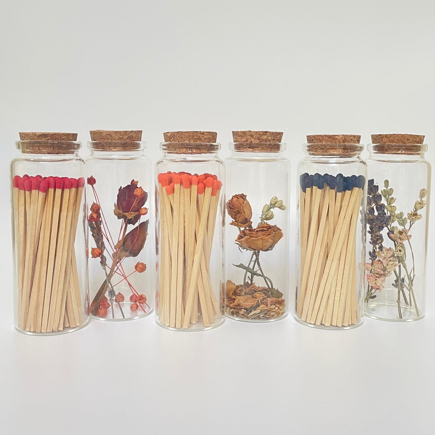 Dried flower test tube gift set with glass match bottle containing 50 safety matches.