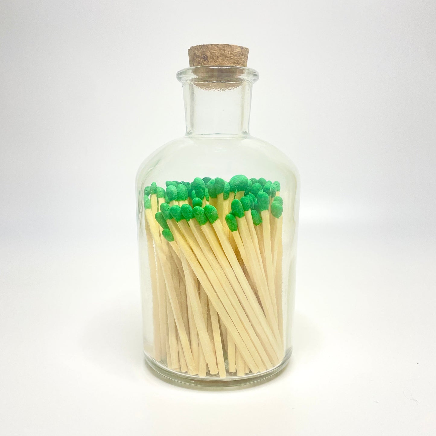 Apothecary match bottle filled with 7.5 cm green matches. 
