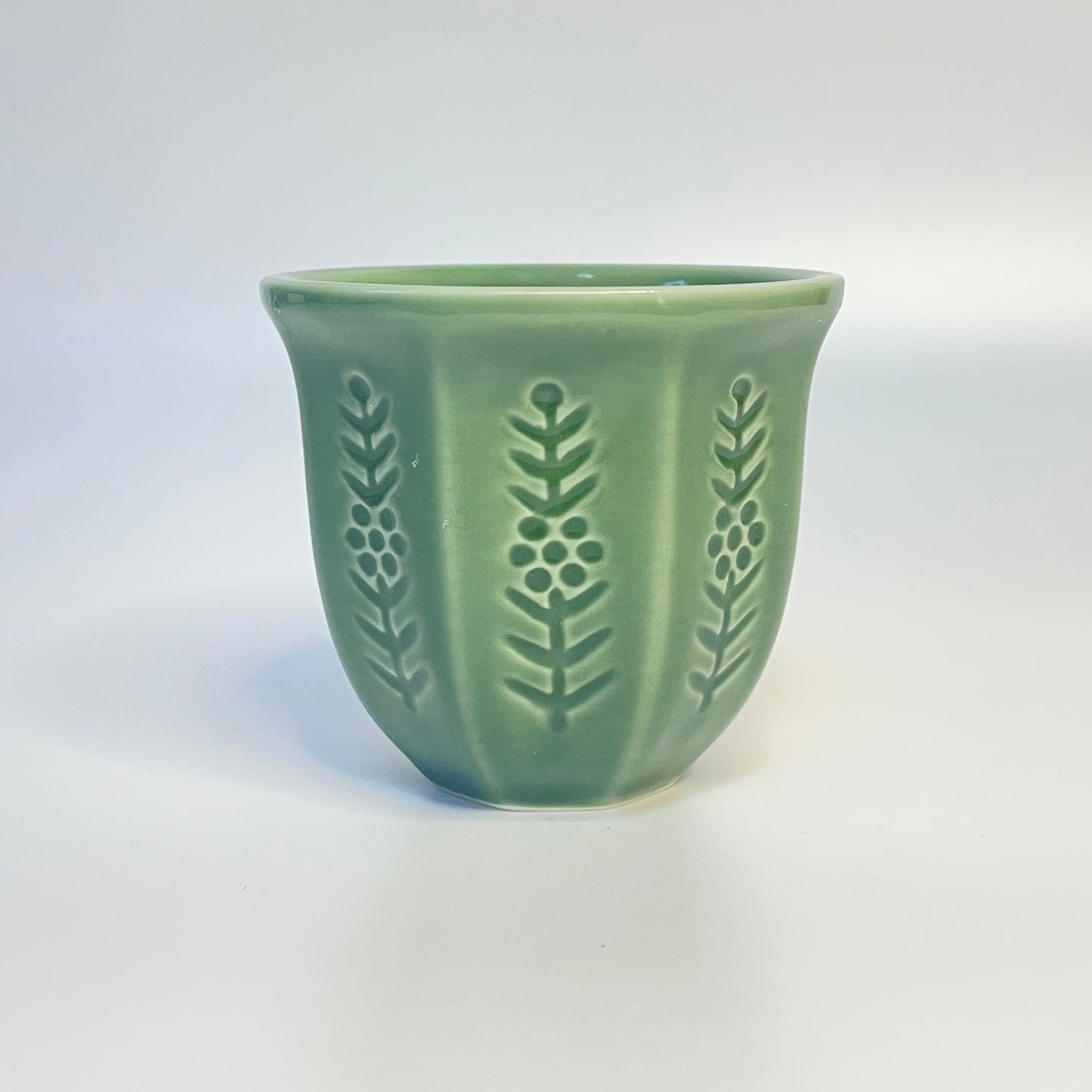 Green match holder/coffee cup. 