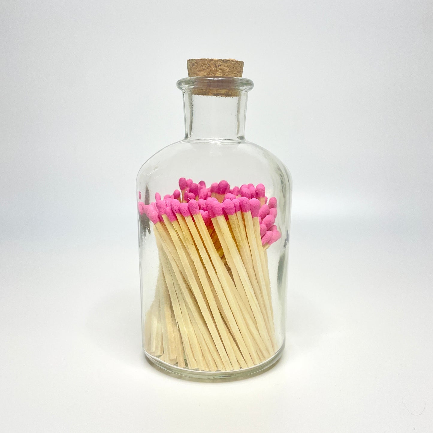 Apothecary match bottle filled with 7.5 cm hot pink matches. 