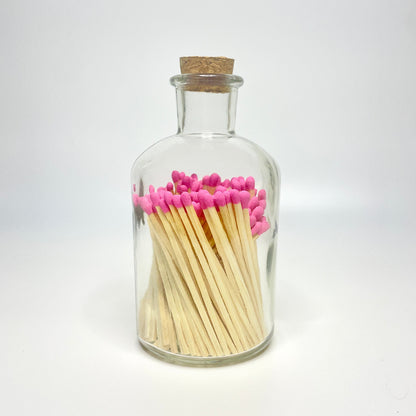 Apothecary match bottle filled with 7.5 cm hot pink matches. 