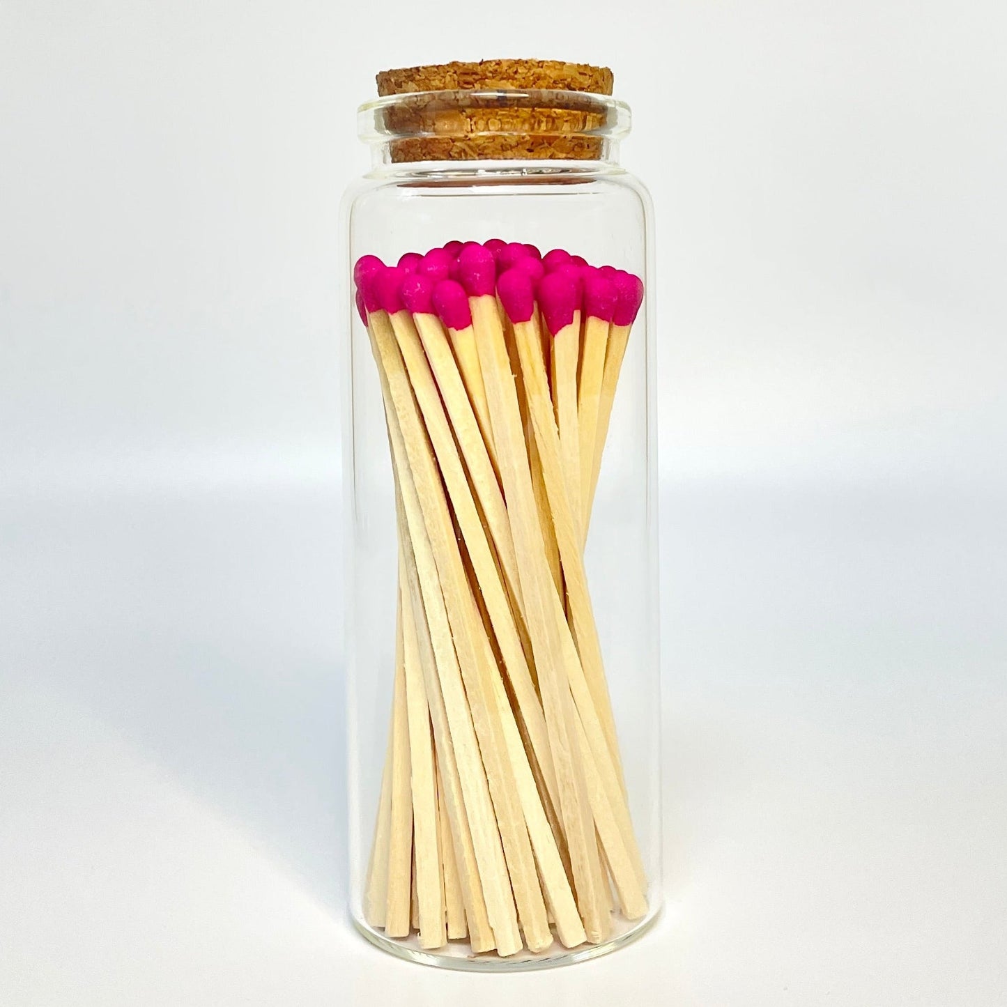 Test tube match bottle filled with 9.8 cm hot pink matches. 