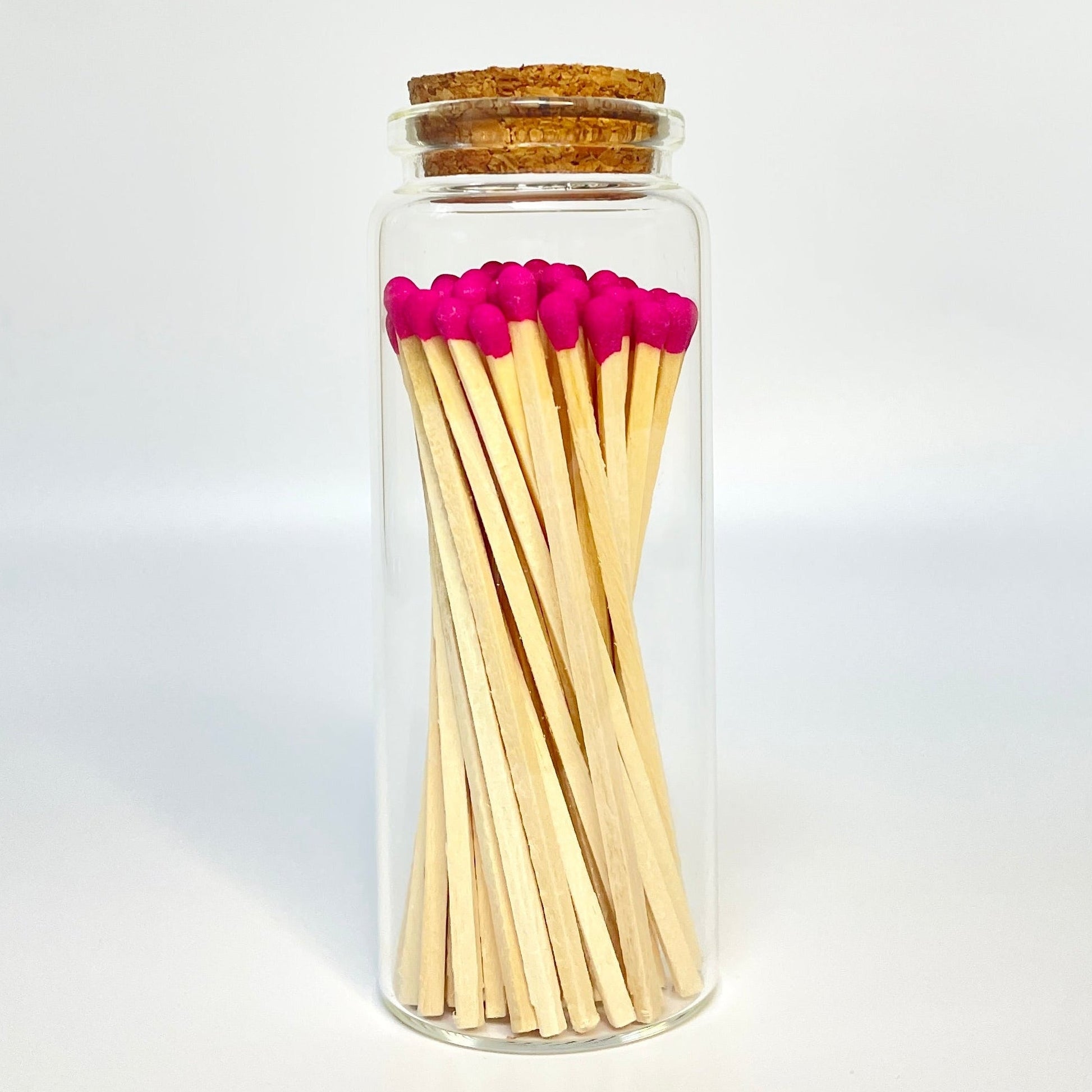 Test tube match bottle filled with 9.8 cm hot pink matches. 
