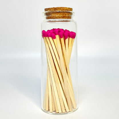 Test tube match bottle filled with 9.8 cm hot pink matches. 