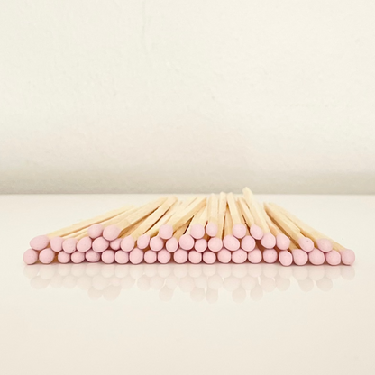 4.8 cm light pink matches on a white surface. 