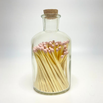 Apothecary match bottle filled with 7.5 cm light pink matches. 