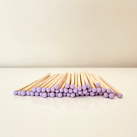 9.8 cm lilac matches on a white surface. 