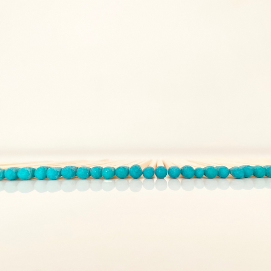 4.8 cm blue matches on a white surface. 