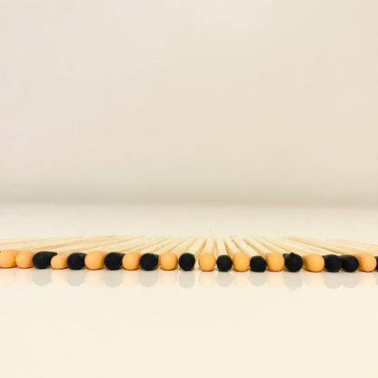 4.8 cm halloween inspired matches on white surface.